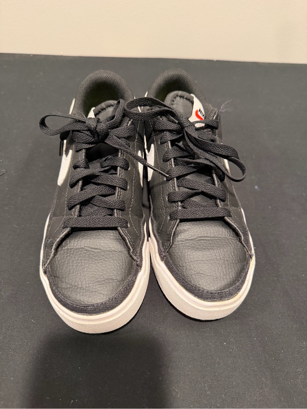 Nike women’s Black Sneakers with White Swoosh